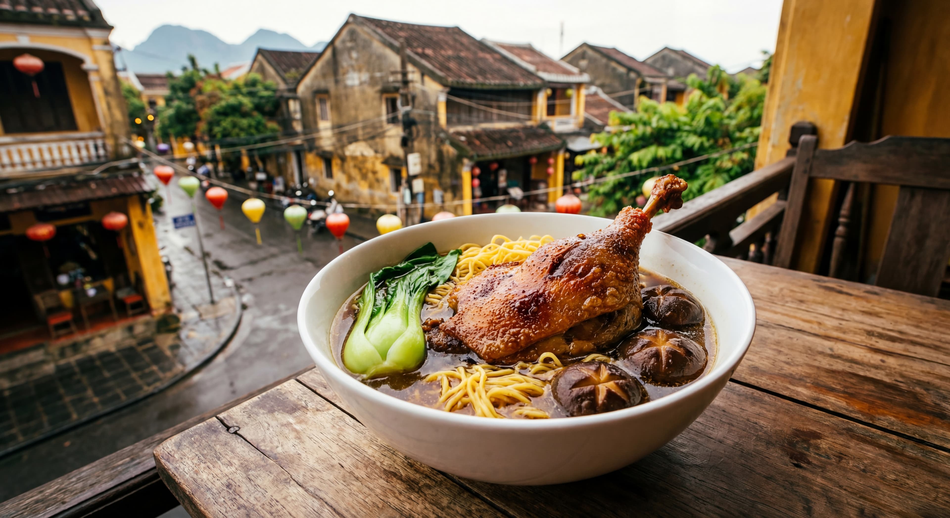 A delicious bowl of Braised Duck Noodle Soup (Mi Vit Tiem) featuring a large duck leg with crispy sk
